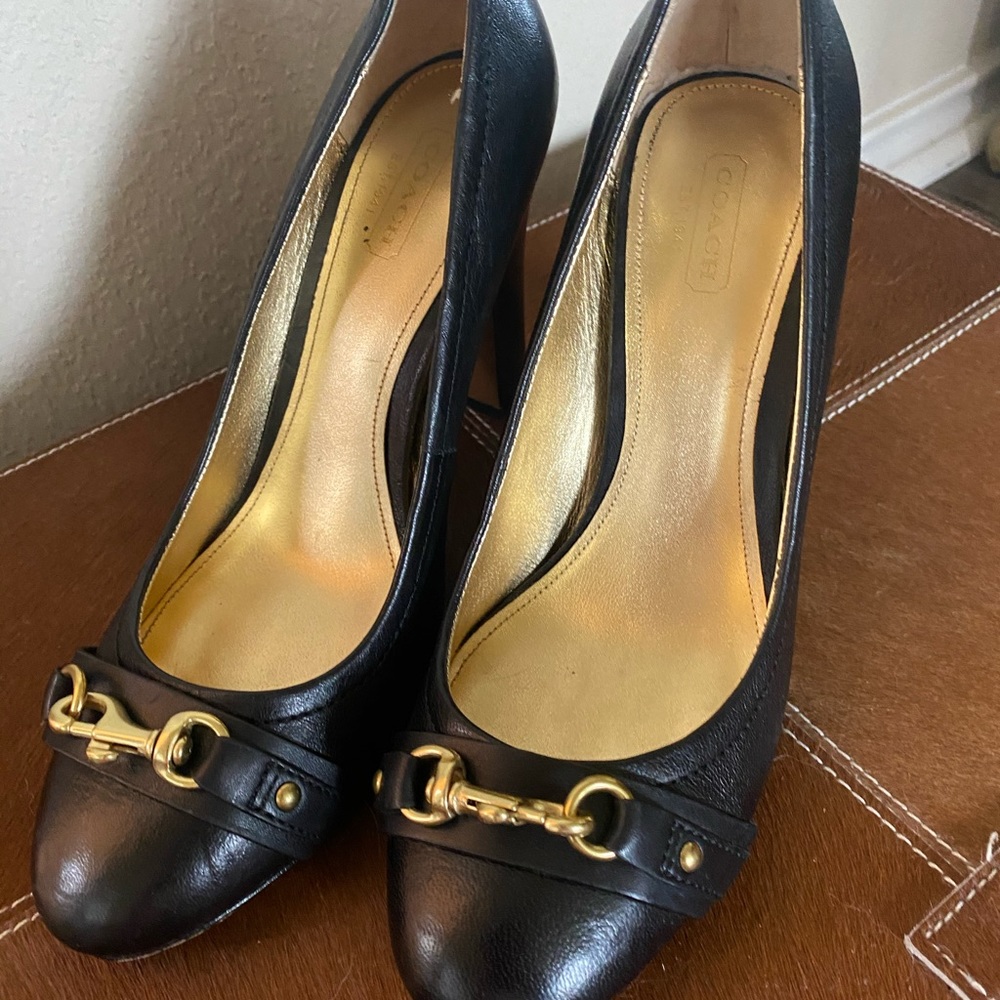 Black leather coach heels. Good condition